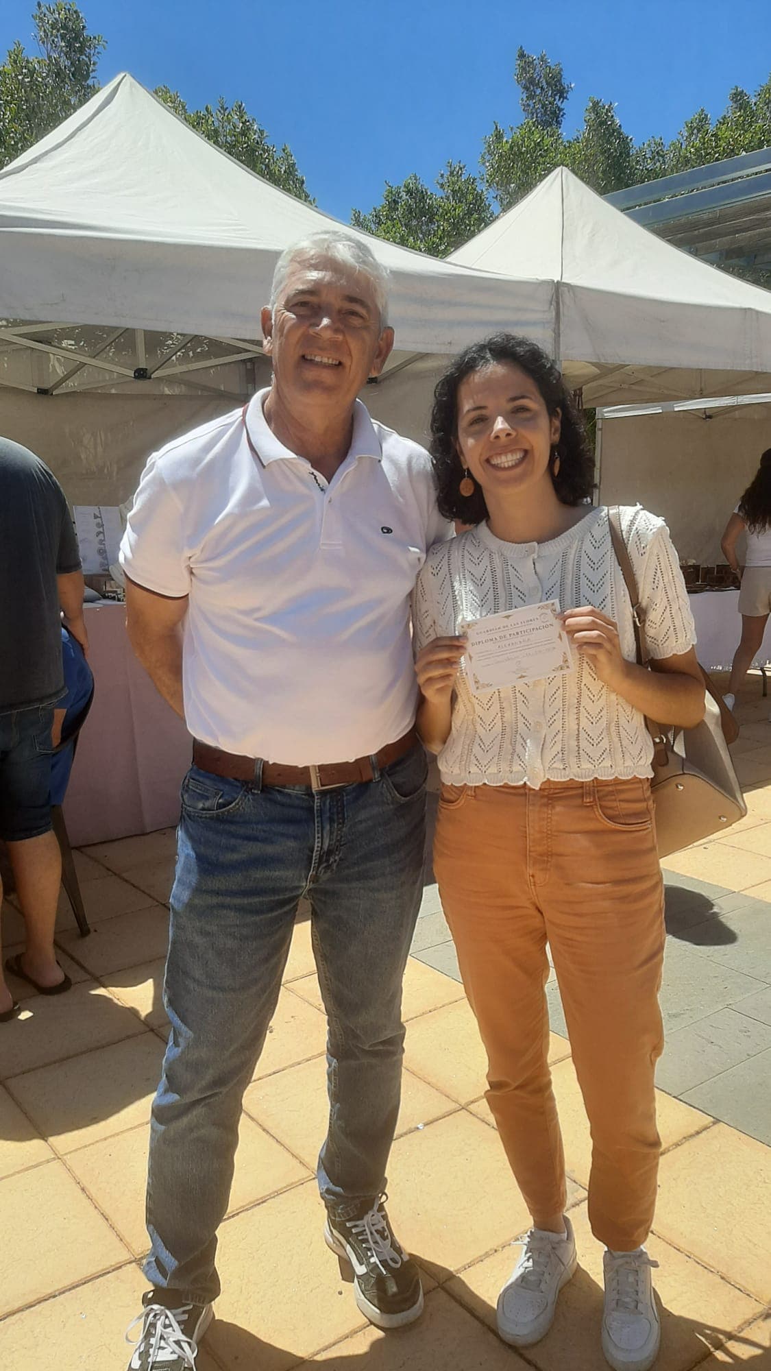 Alexandra, member of the Young Citizens Assembly on Pollinators of the European Commission, with Matias Gonzalez, creator of Universo Nahiara - Alexandra painted the Canarian lizard, a documented pollinator of the endemic flora of the Canary Islands, and received her Diploma as Guardian of the Flowers - 21 June 2026