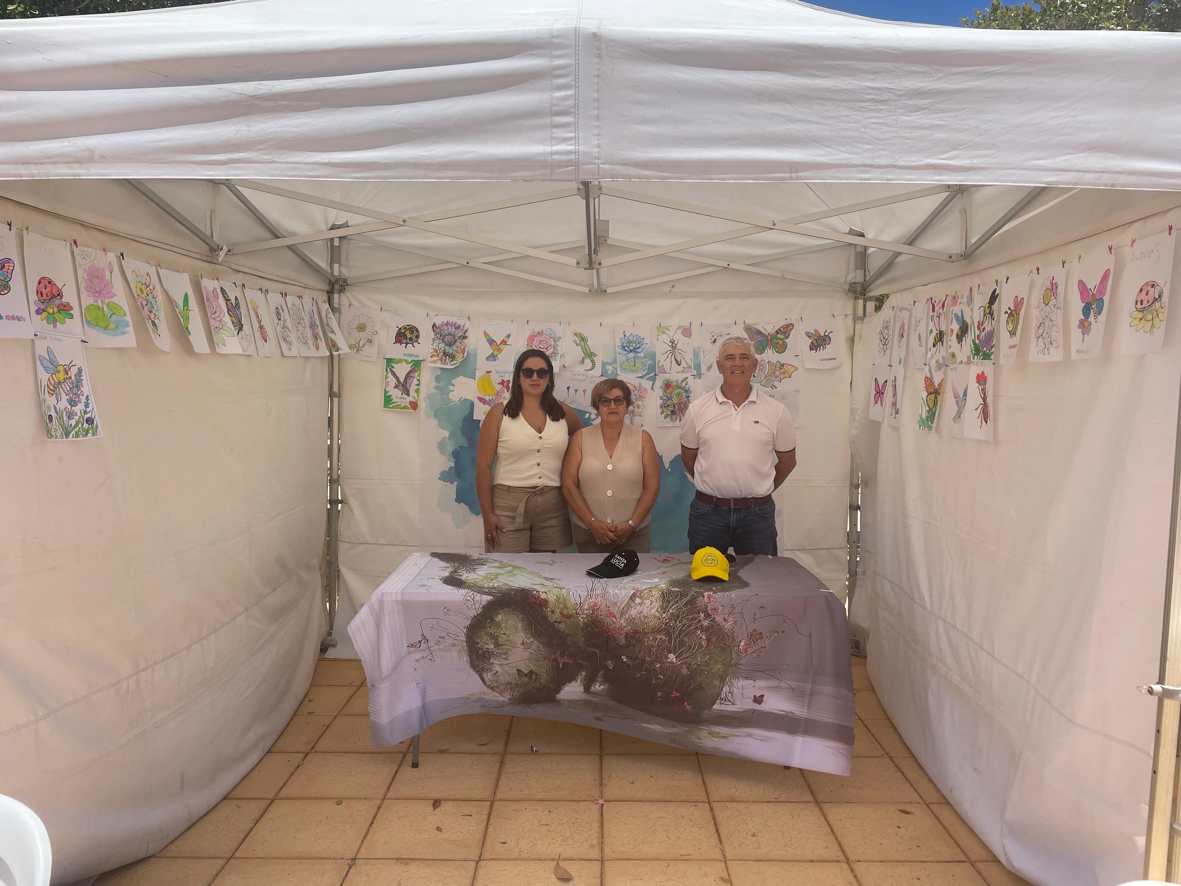 Closing of the Day of All Pollinators - The Board of Directors of the International Association for the Defence of Flowers beside the collective mural of flowers and pollinators from around the world - La Blanca, Sardina del Sur - 21 June 2026 - All artworks will be available soon at the dedicated link